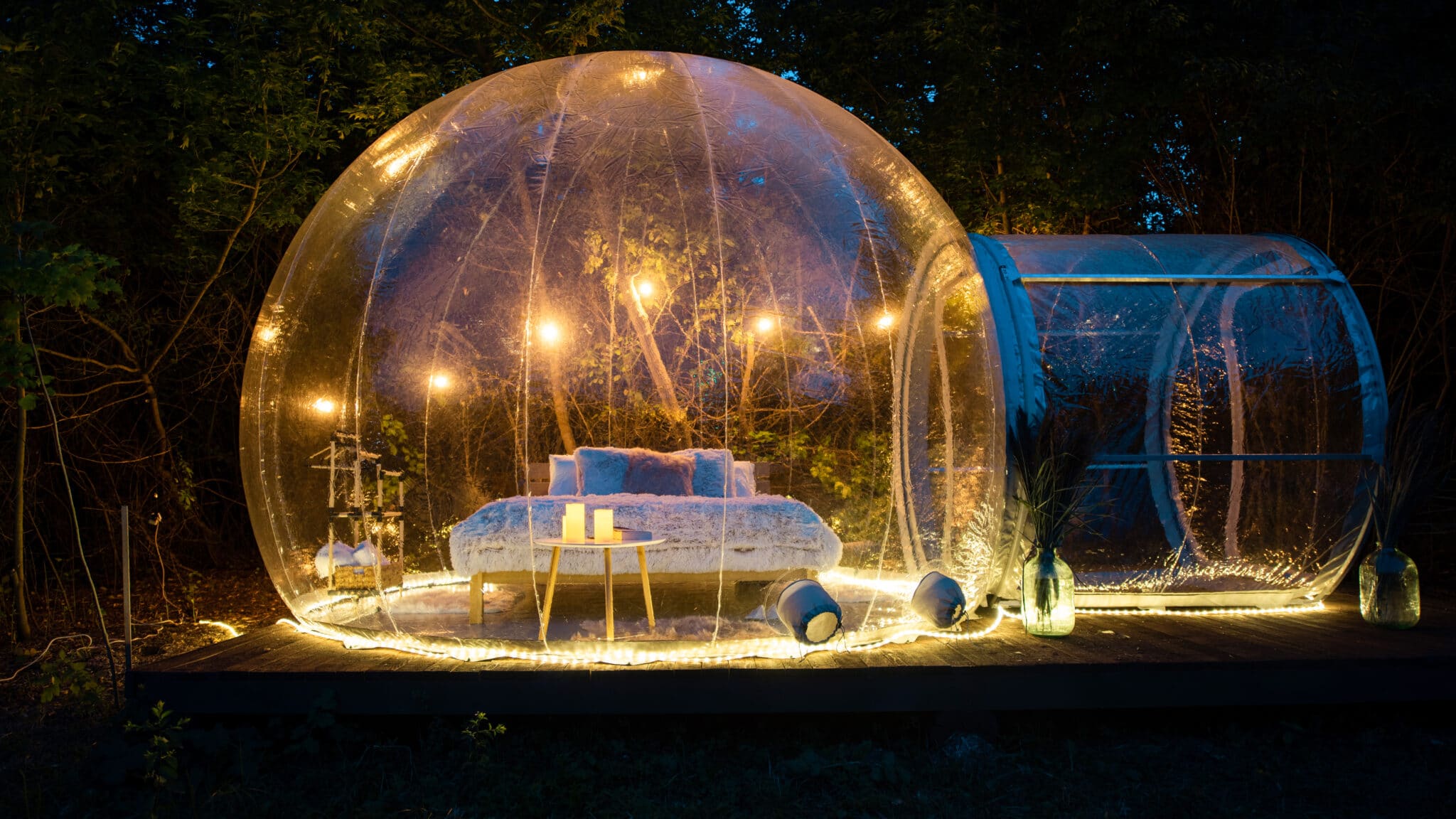 Transparent bubble tent at glamping at night