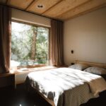 Minimalistický letní dům s velkoformátovým oknem