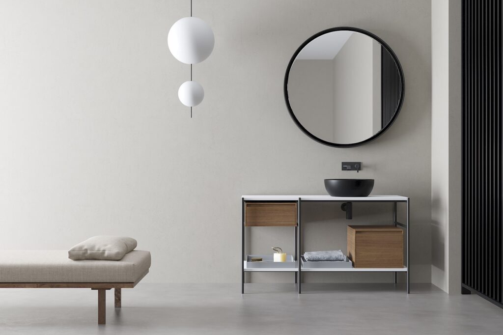 Minimalistická designová koupelna s kulatým zrcadlem